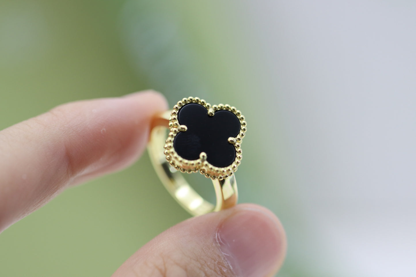 Champagne gold and black onyx four-leaf clover ring