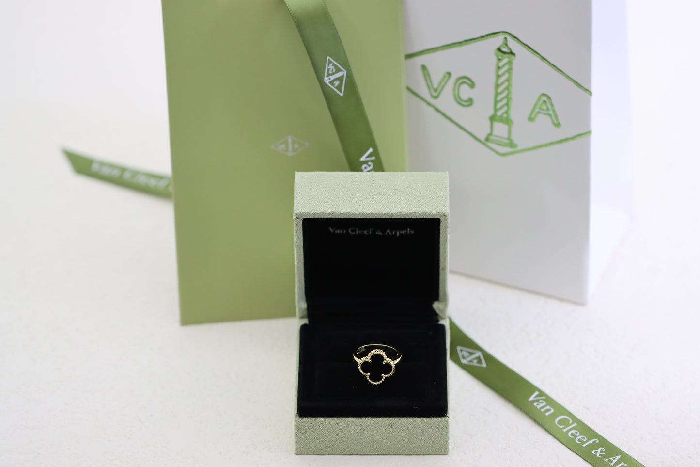 Champagne gold and black onyx four-leaf clover ring