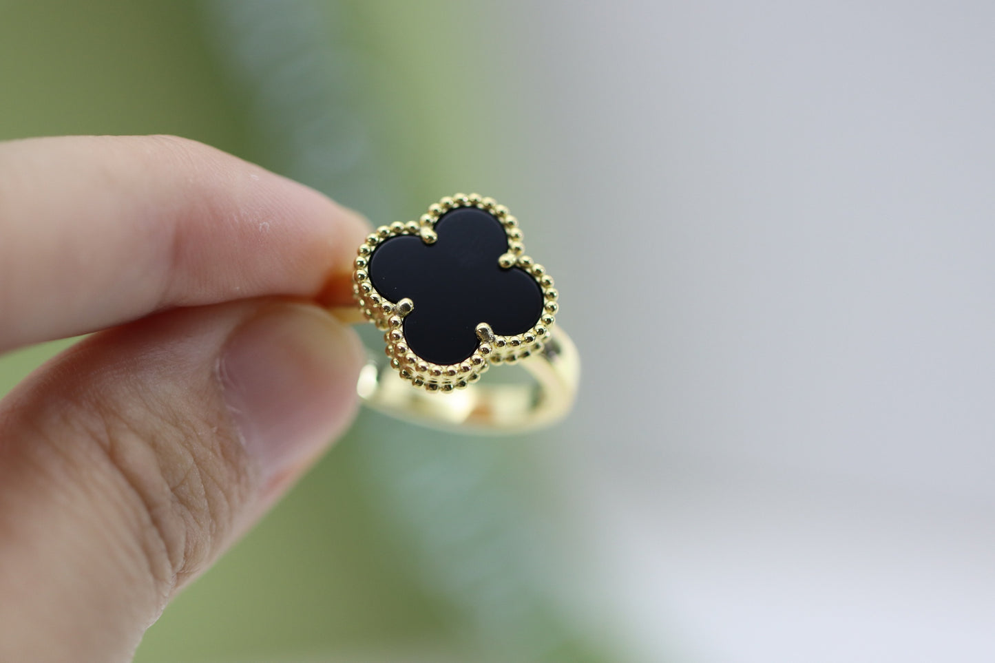 Champagne gold and black onyx four-leaf clover ring