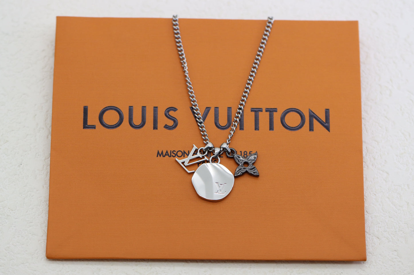 Titanium floral letter necklace