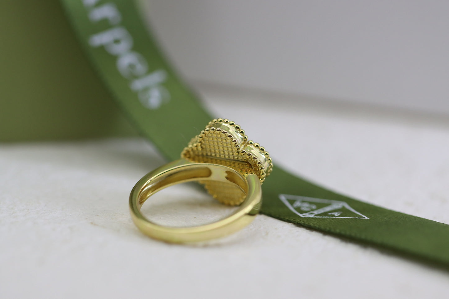 Champagne gold and black onyx four-leaf clover ring
