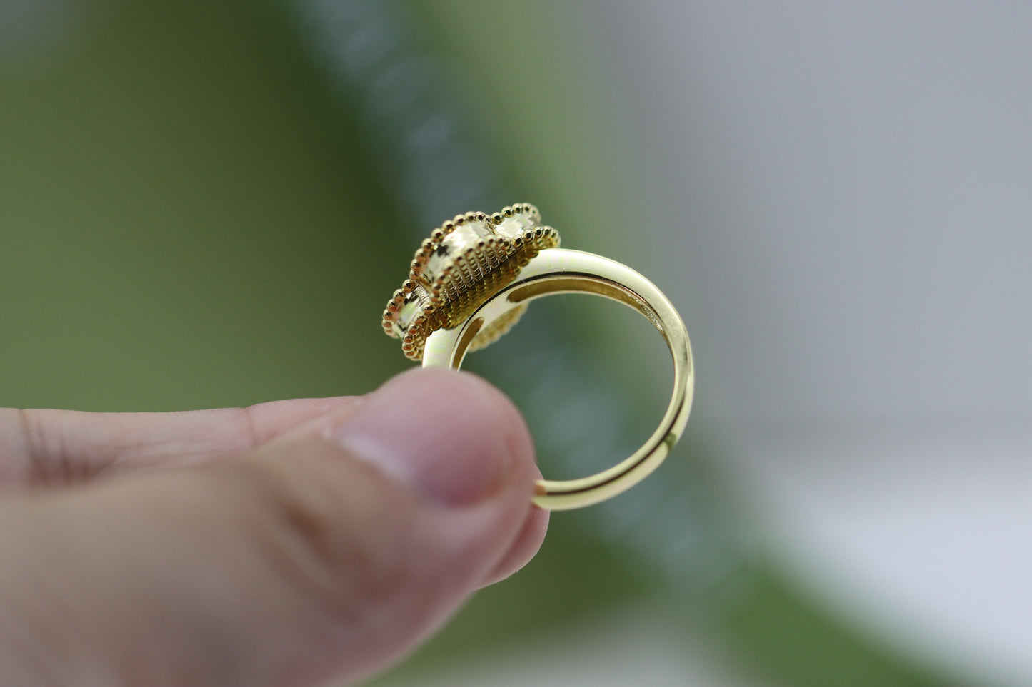 Champagne gold and black onyx four-leaf clover ring