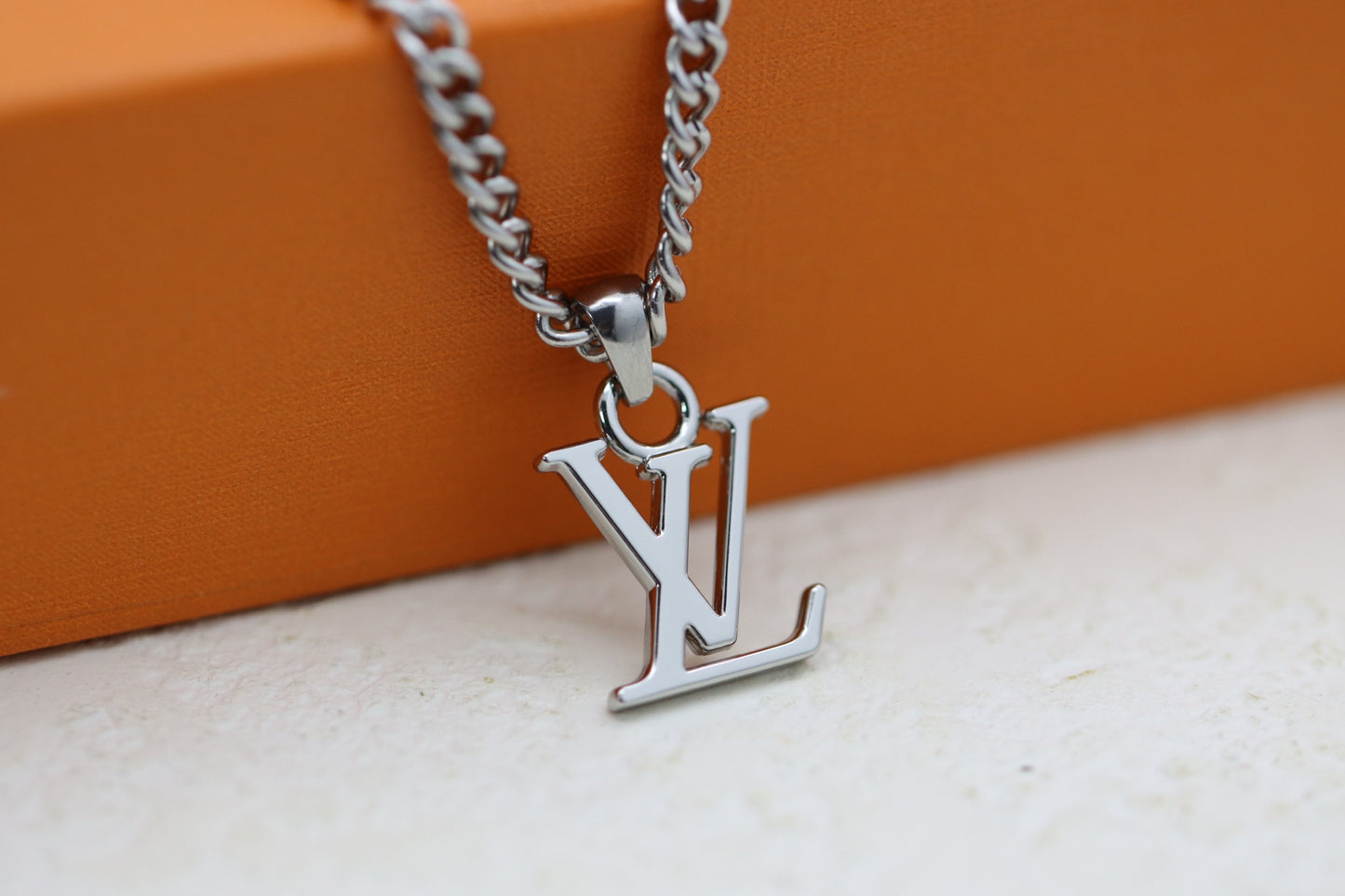 Titanium floral letter necklace